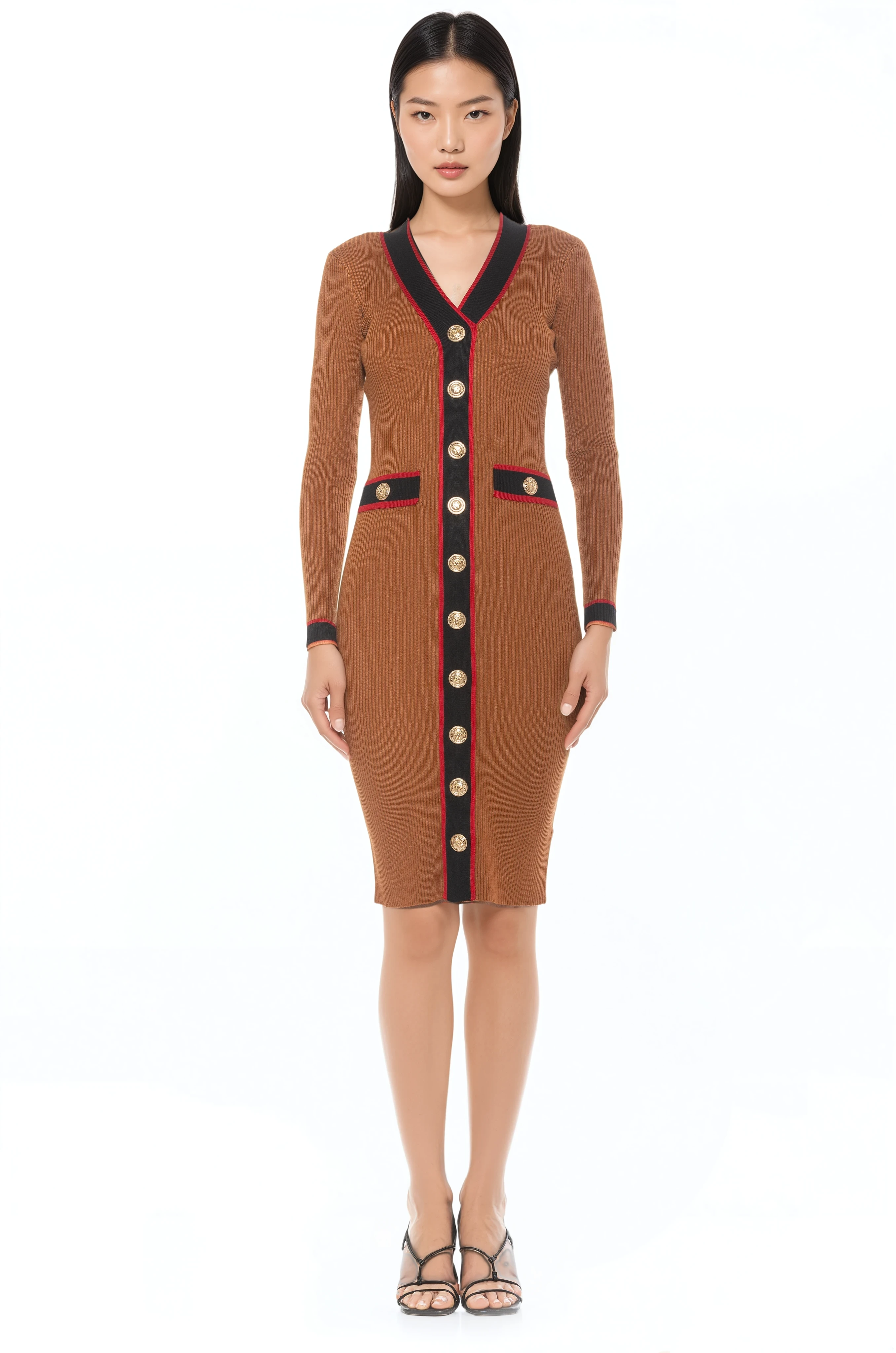 Front view camel v-neck knit dress, long sleeves, contrast black and red trim with gold button detailing.