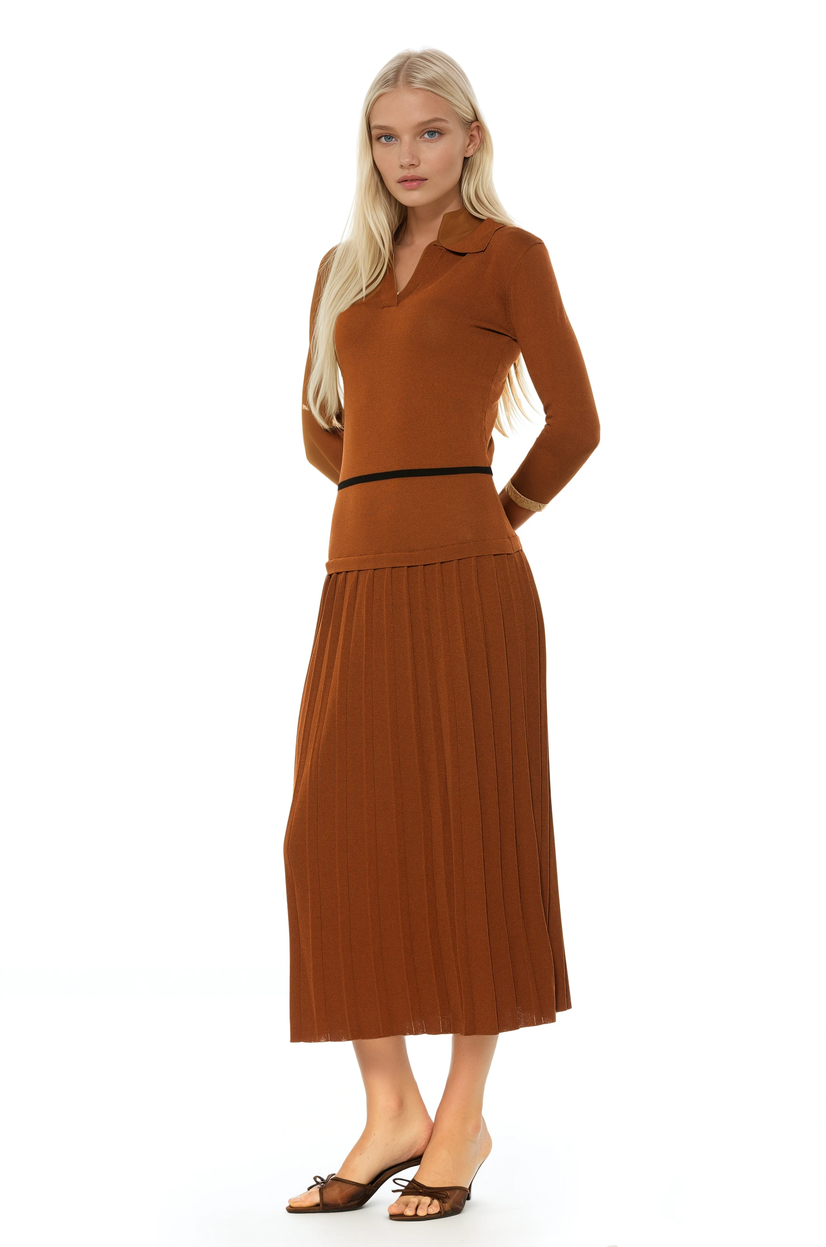 Side view camel knit midi dress with drop waist, contrast black detail, pleated bottom, knit collar and 3/4 sleeves.