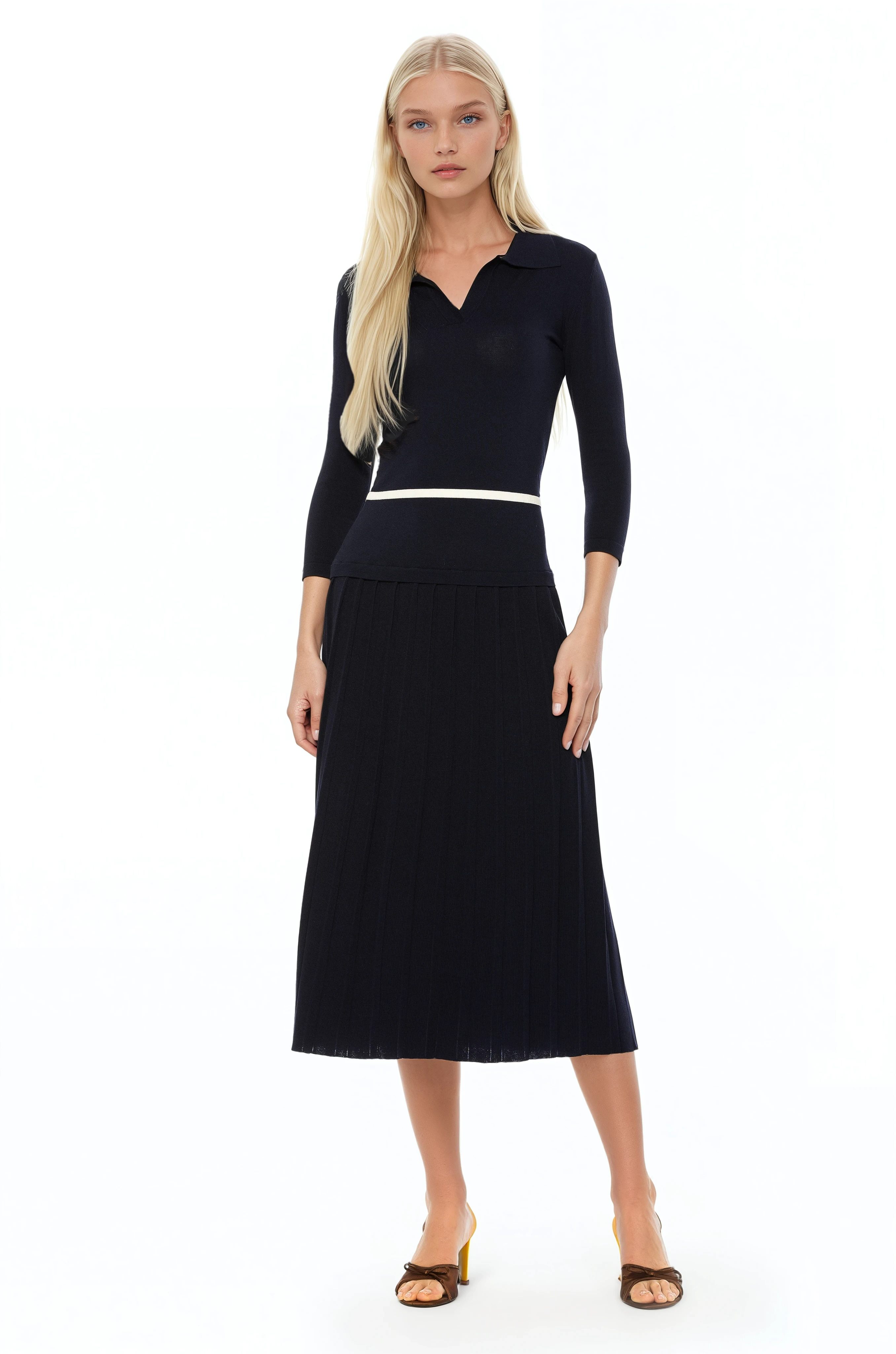 Front view black knit midi dress with drop waist, contrast white detail, pleated bottom, knit collar and 3/4 sleeves.