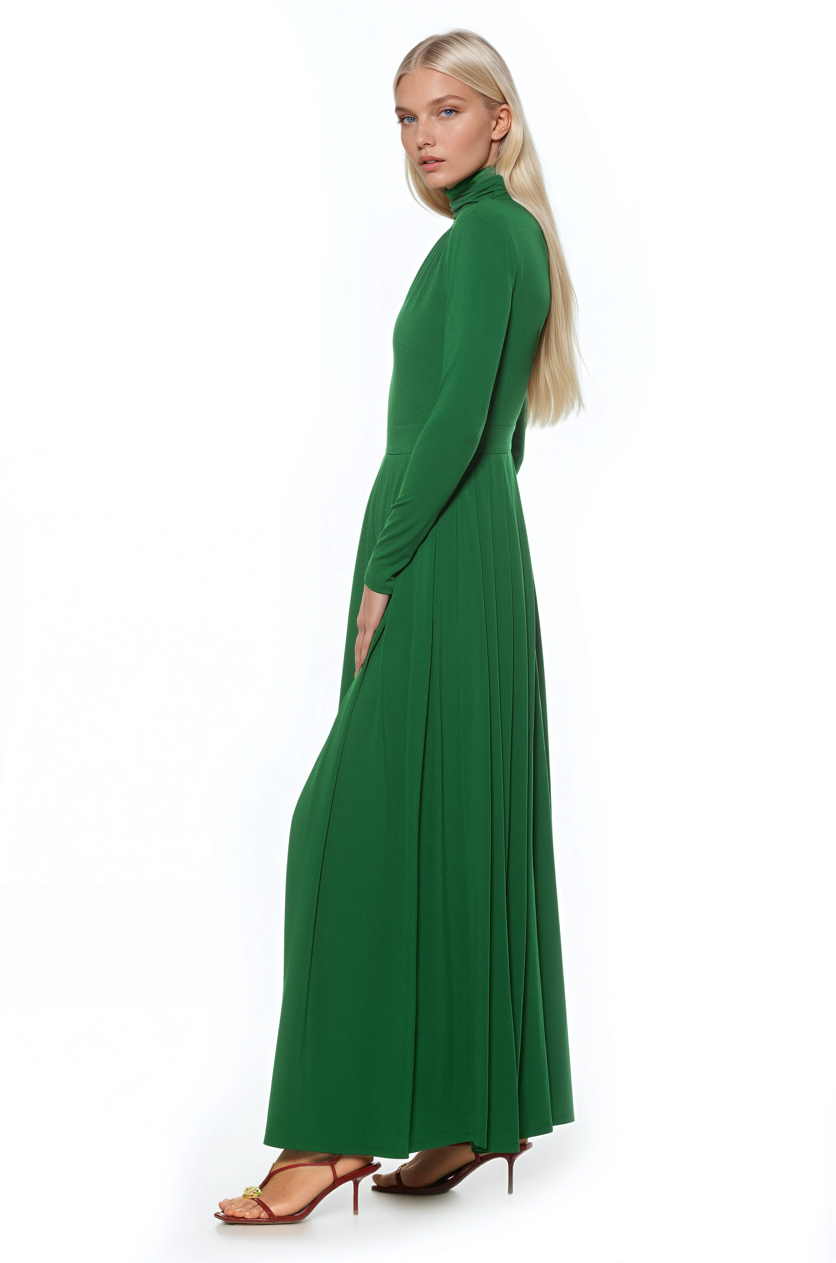 Side view emerald green long sleeve maxi dress, mock neck, pleated skirt.