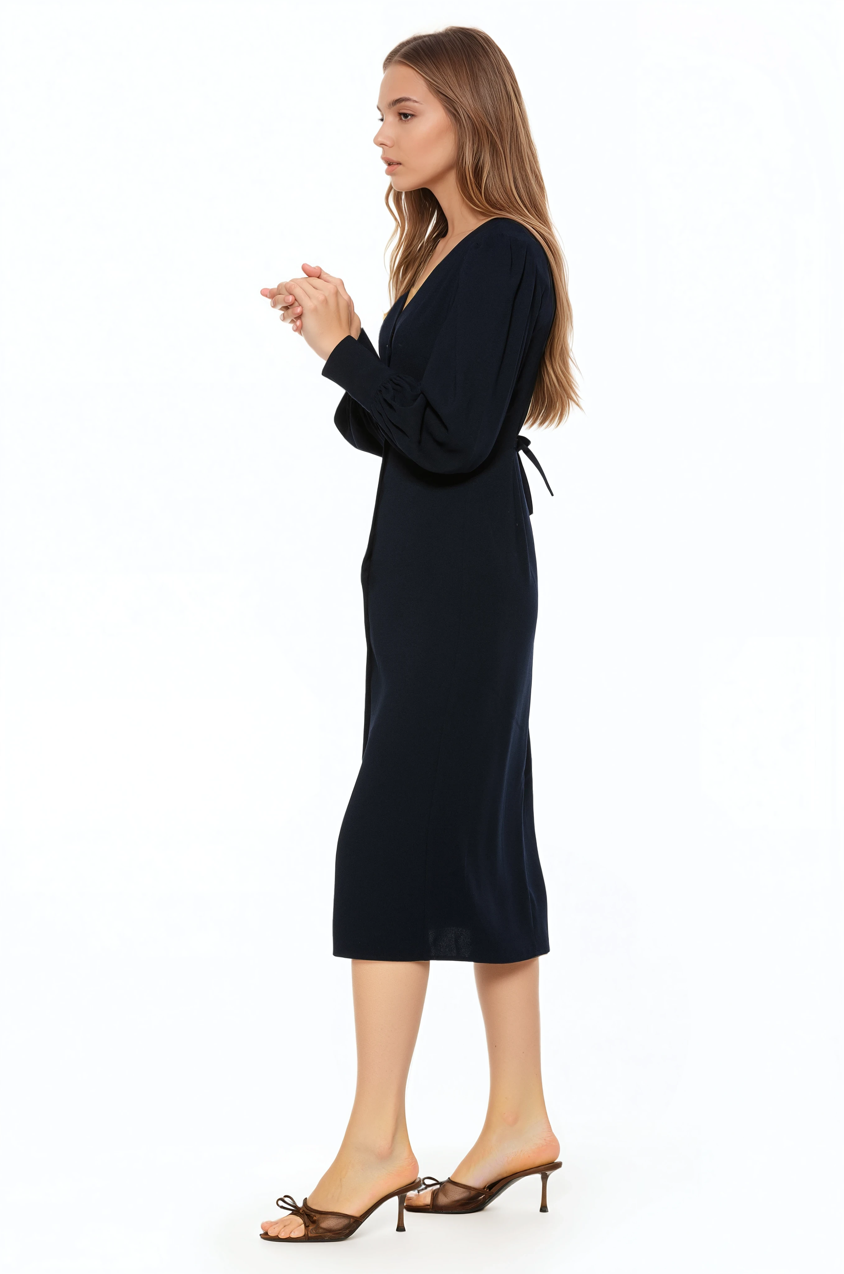 Side view navy midi dress with v-neck, button front, blouson sleeves with button cuffs.