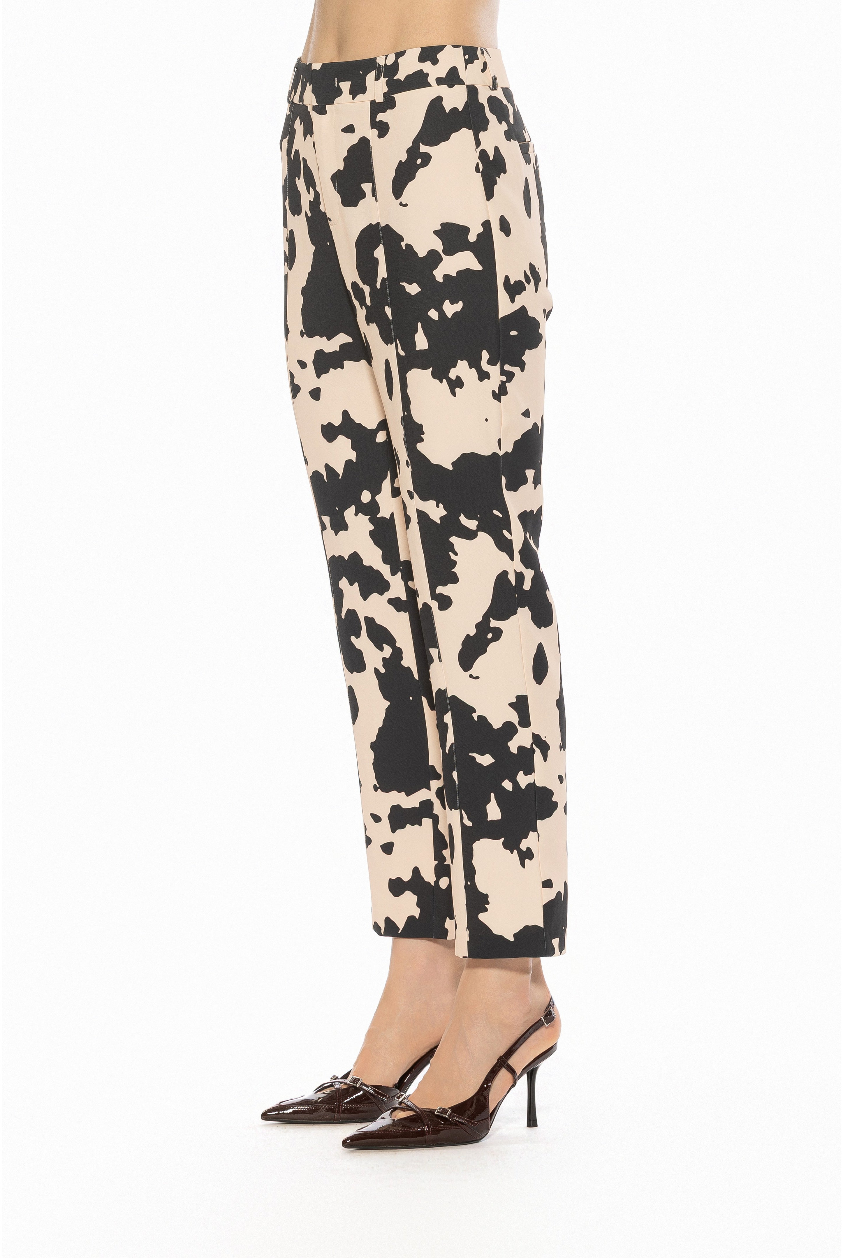 Side view cow print slim fit pant, no pockets.