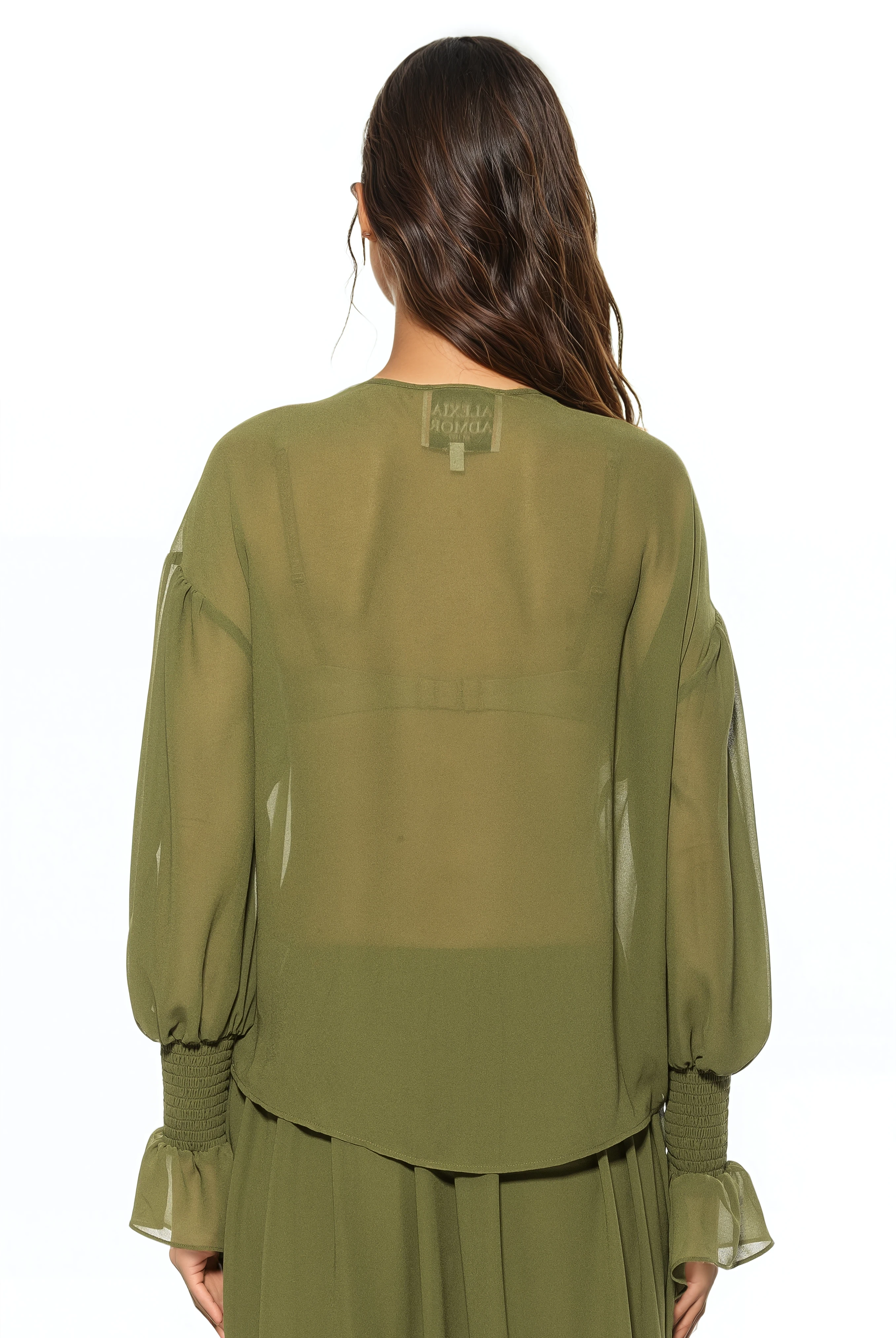 Back view green ruffle blouse, shirt tail hem, blouson sleeve with smocked ruffle cuff.