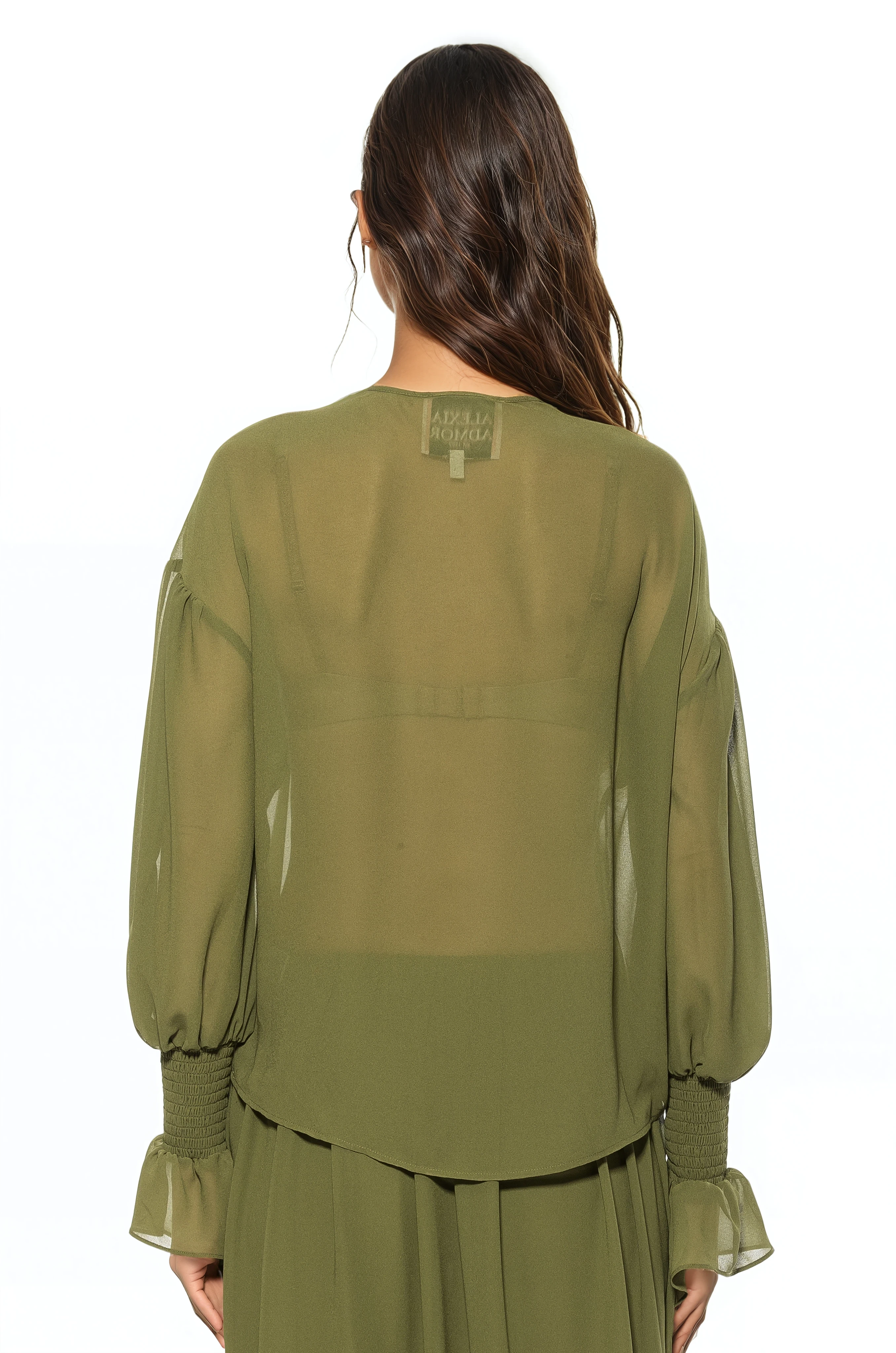 Back view green ruffle blouse, shirt tail hem, blouson sleeve with smocked ruffle cuff.