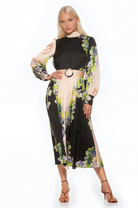 Front view black and cream floral maxi dress, long sleeve, blouson sleeves with wide cuffs, belted.