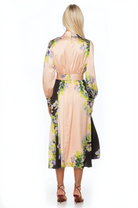Back view black and cream floral maxi dress, long sleeve, blouson sleeves with wide cuffs, belted.