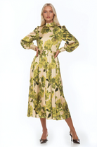 Front view green floral maxi dress, long sleeve, blouson sleeves with wide cuffs, belted.
