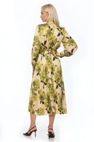 Back view green floral maxi dress, long sleeve, blouson sleeves with wide cuffs, belted.