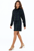 Side view green plaid mini dress, long sleeves, contrast black collar and cuffs, plaid button front.