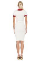 Back view ivory v-neck knit dress, short sleeve, contrast red and navy trim.