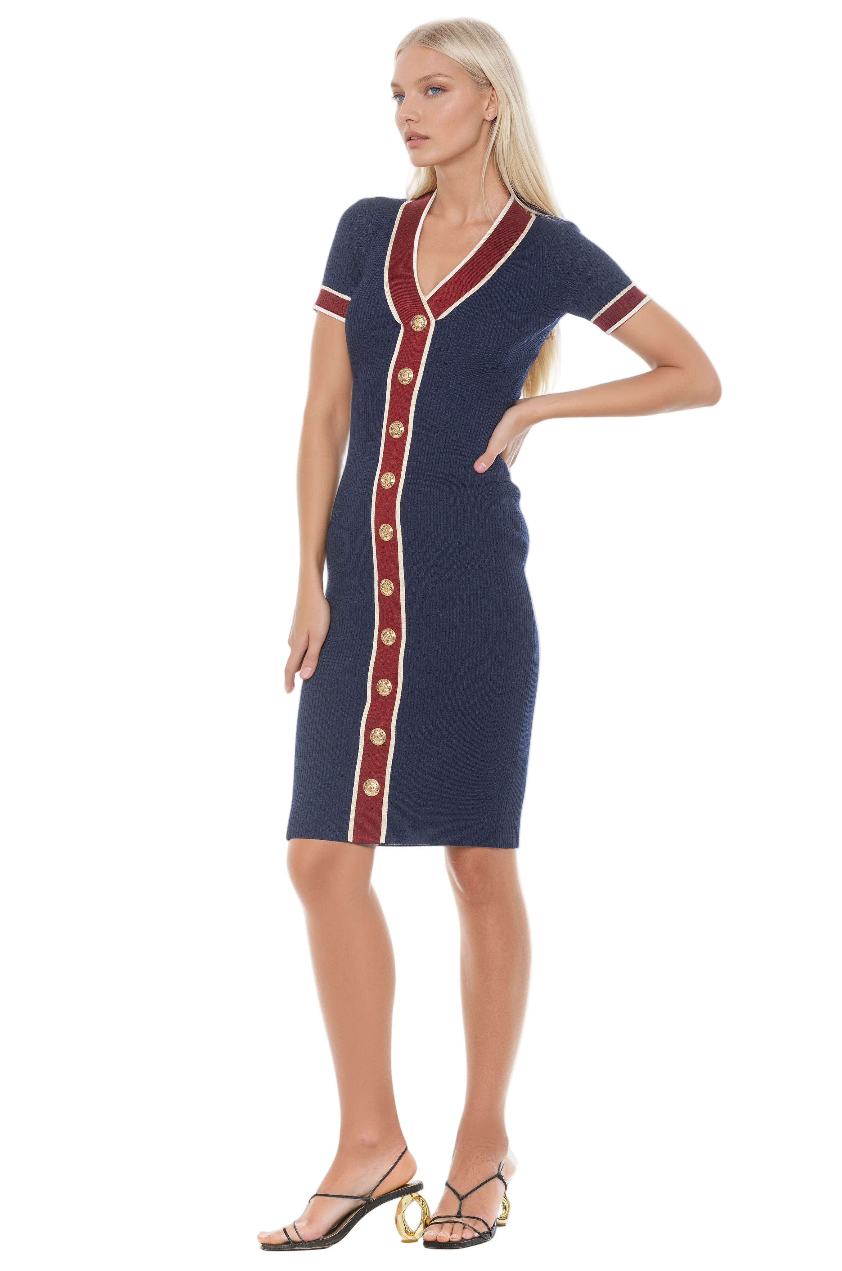 Side view navy v-neck knit dress, short sleeve, contrast red and ivory trim with gold button detailing.