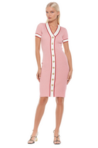Front view pink v-neck knit dress, short sleeve, contrast ivory and red trim with gold button detailing.