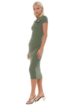 side view sage green rib knit midi dress, short sleeves, crew neck, gold button, and black contract detail.