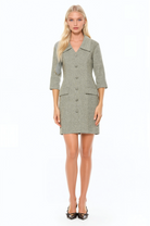 Front view herringbone shift dress, 3/4 sleeve button front with dropped collar and flap pockets.
