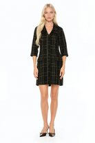 Front view black plaid shift dress, 3/4 sleeve button front with dropped collar and flap pockets.