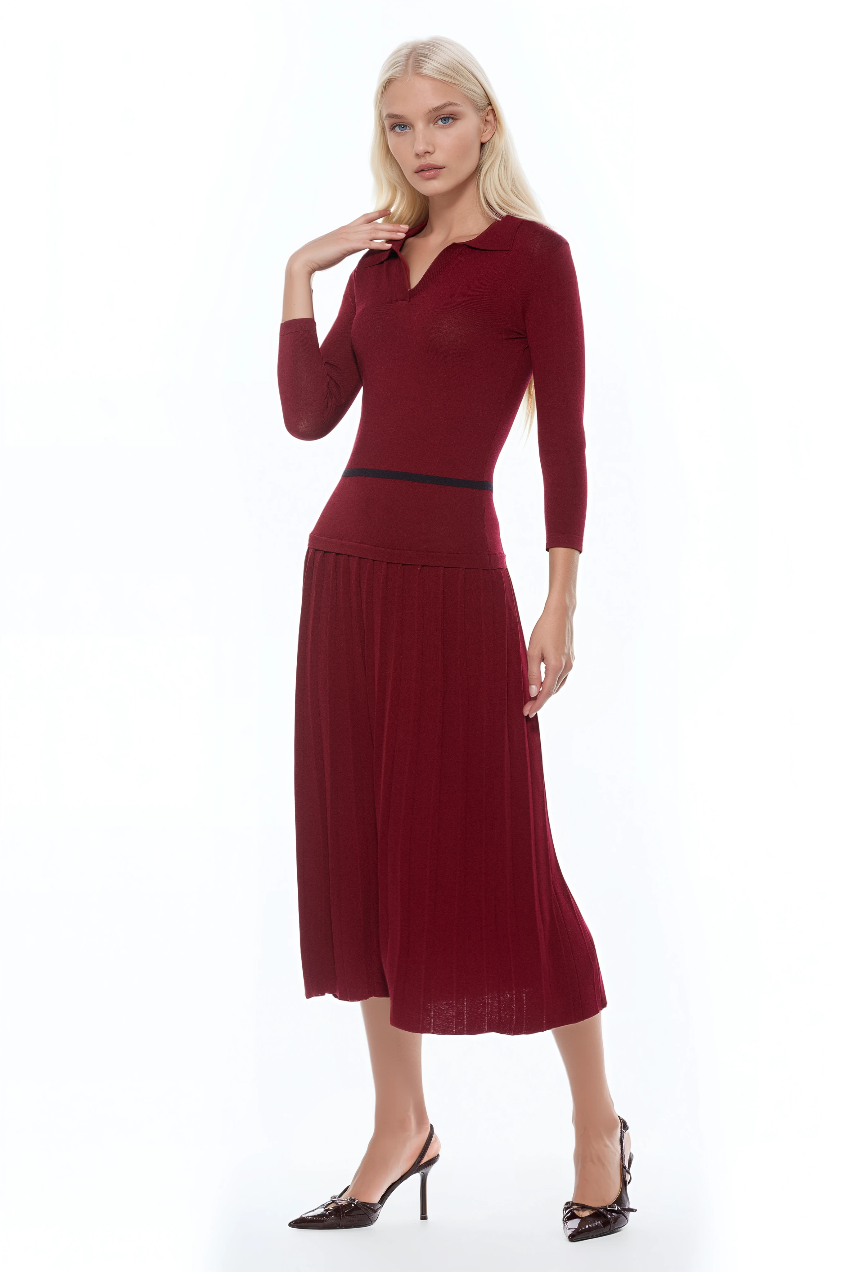 Front view burgundy knit  midi dress with drop waist, contrast black detail, pleated bottom, knit collar and 3/4 sleeves.