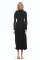 Front view black long sleeve midi dress sheered drop waist detail, mock neck.