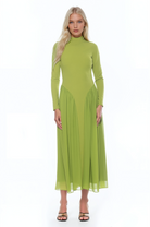 Front view green long sleeve midi dress sheered drop waist detail, mock neck.