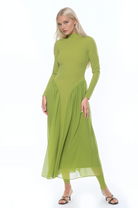 Front view green long sleeve midi dress sheered drop waist detail, mock neck.