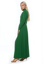 Side view emerald green long sleeve maxi dress, mock neck, pleated skirt.
