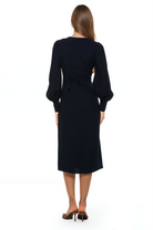 Back view navy midi dress with adjustable tie back, blouson sleeves with button cuffs.