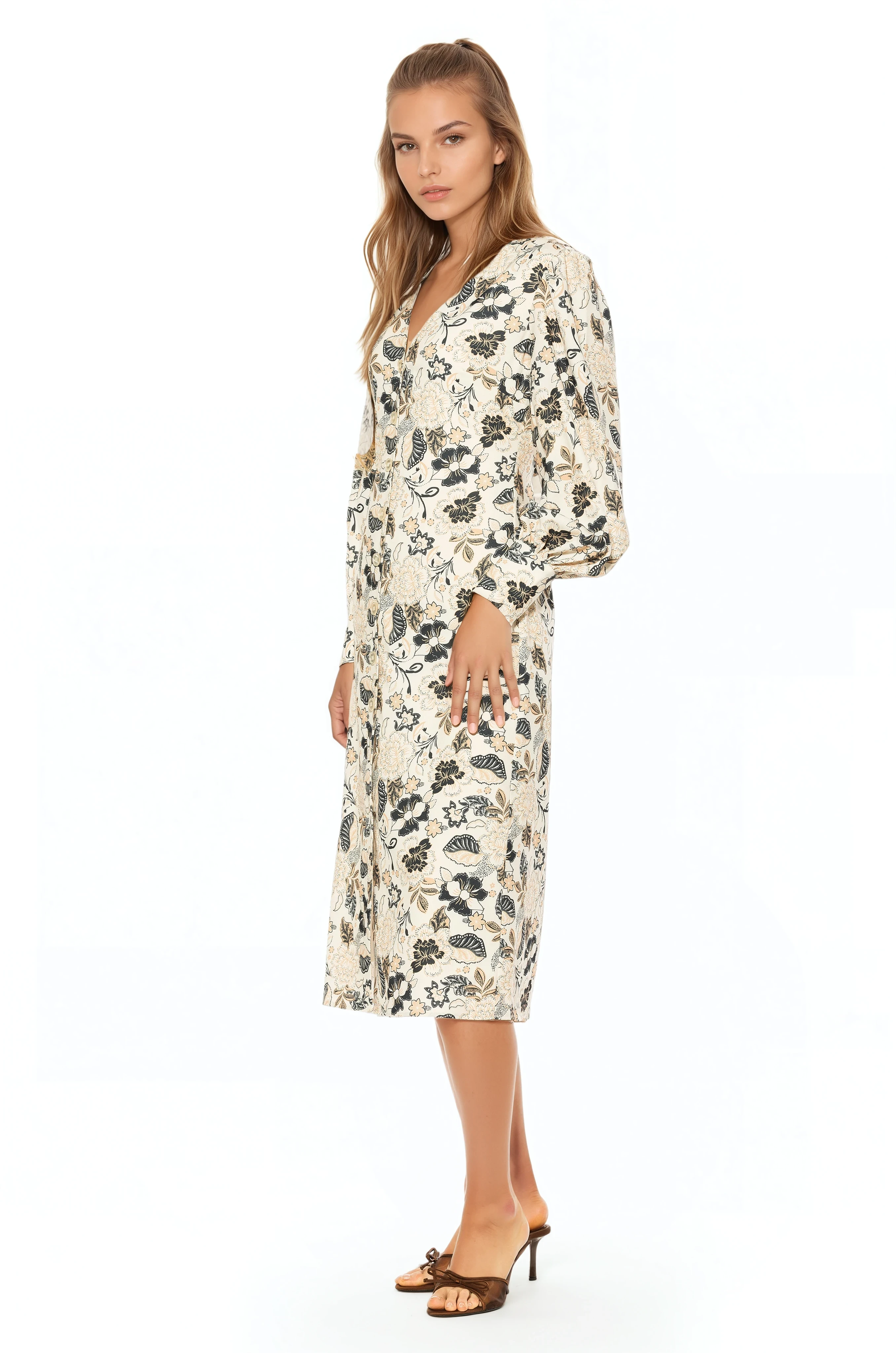 Side view ivory paisley print midi dress with v-neck, button front, blouson sleeves with button cuffs.