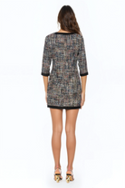 Front view tweed mini shift dress,  3/4 sleeve, black contrast hems.