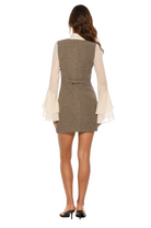 Back view Herringbone vest dress, mock ivory ruffle sleeve blouse, adjustable back slider.