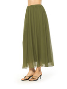 Side view green max skirt elastic waist.